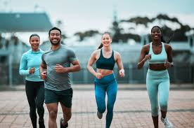 Sculpting Sleek Arms: The Essential Role of Cardio in Toning Without Bulking Up 3 image of people running to incorporate cardio Brentwood exercise into their life to help tone arms and body.